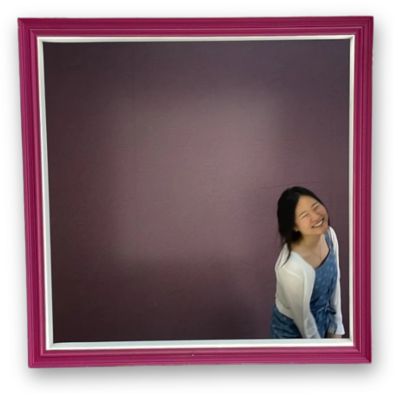 Michelle Park smiling inside a magenta picture frame